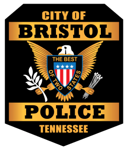 Picture of City of Bristol (TN) police patch. Eagle holding branches centered with name of city and state above and below eagle. "The best of two states" bordering a picture of an American Flag.