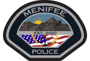 Photo of Menifee (CA) Police Patch. Name of Department and pictures of mountains and a sunset in the background. "EST 2020" set above a picture of an American flag and the scales of justice.